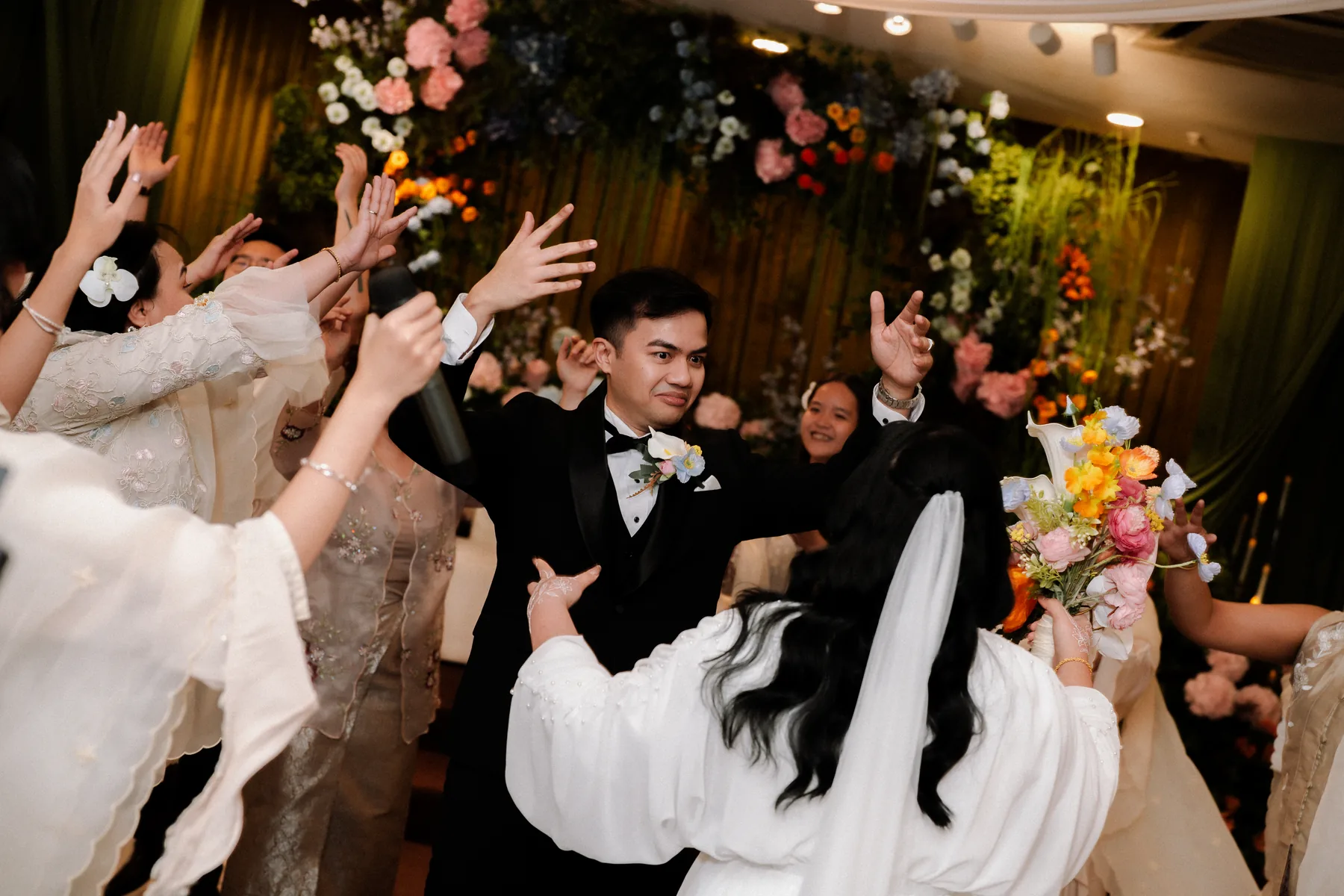 Wedding guests celebrating with the couple
