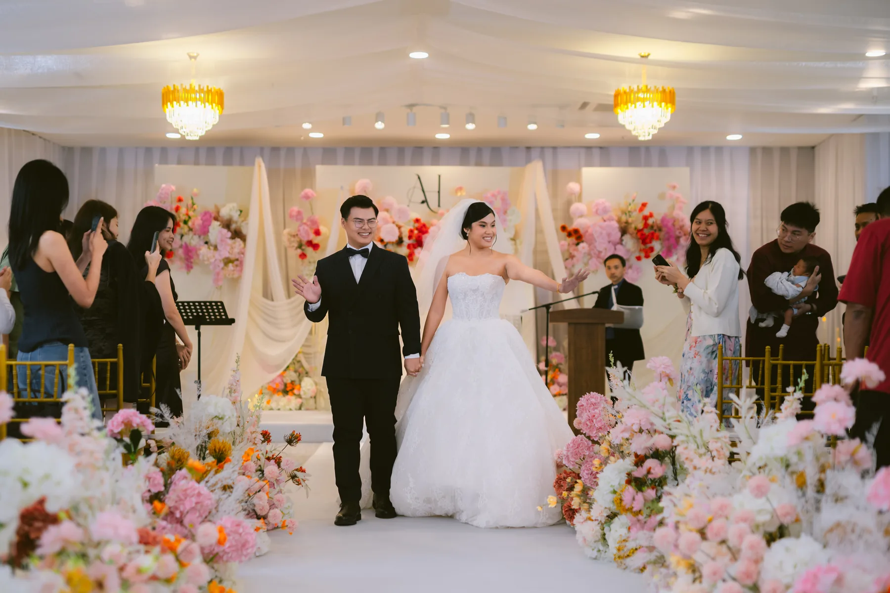 Bride and groom entering their wedding reception
